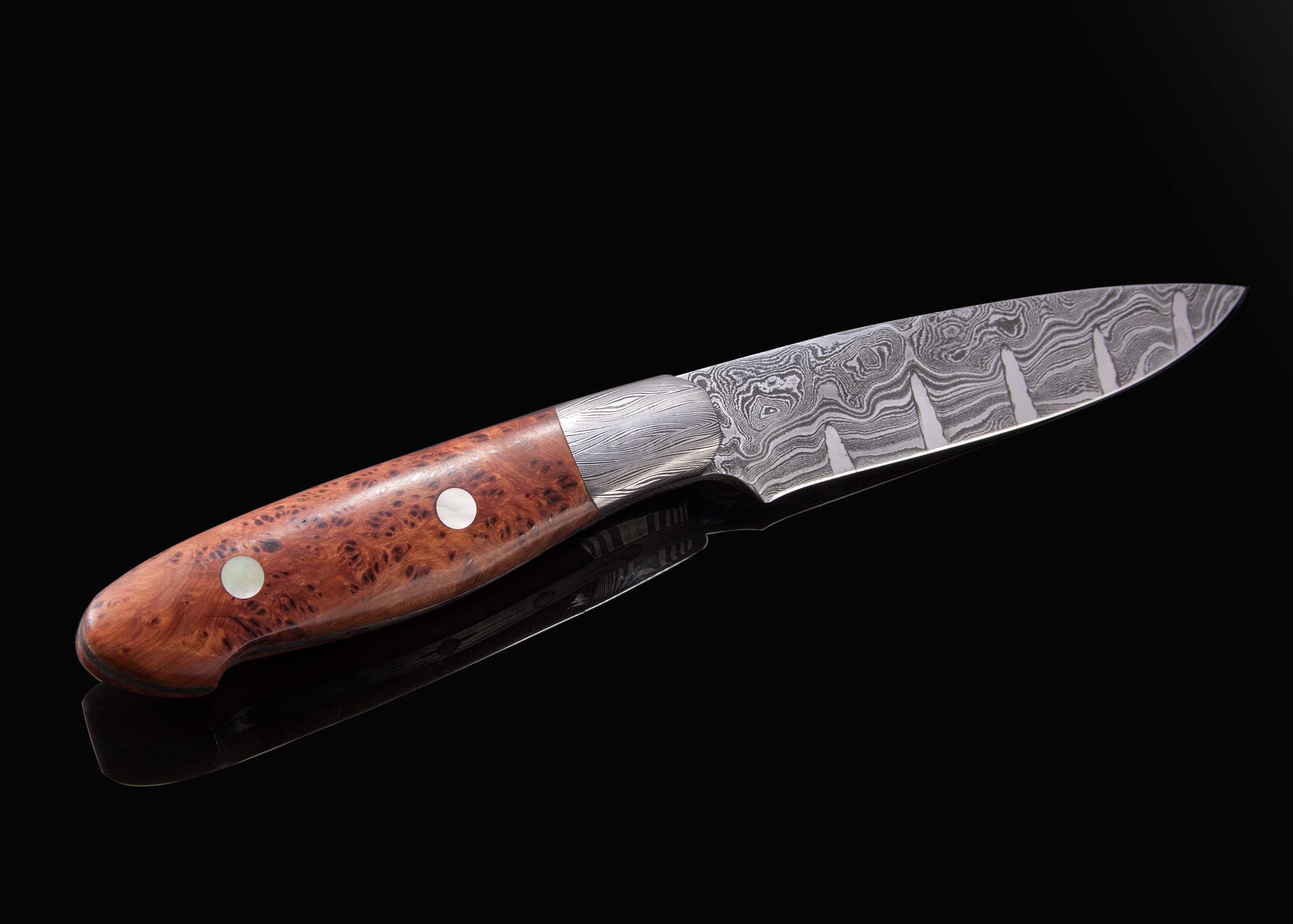 Pukeashun Damascus with Juniperburl and Gold Lip Pearl Inlay Hunter other side